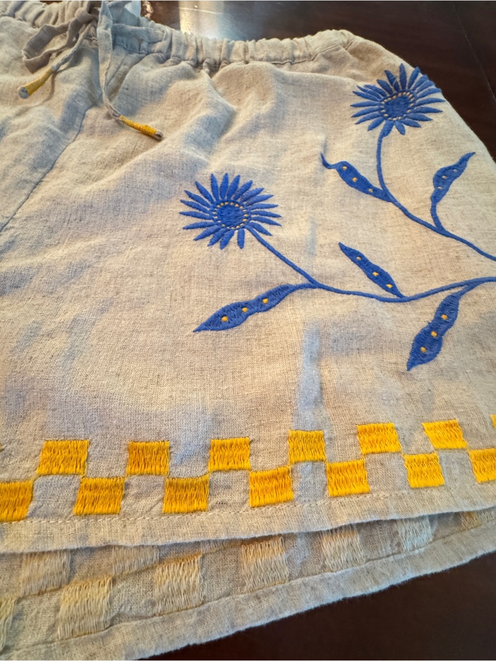Anthropologie Beige Linen Shorts with Blue Floral Embroidery and Yellow Trim